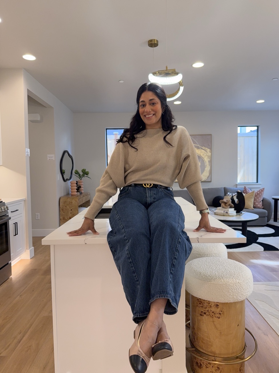 Pooja Kwatra inside a bright new-construction home